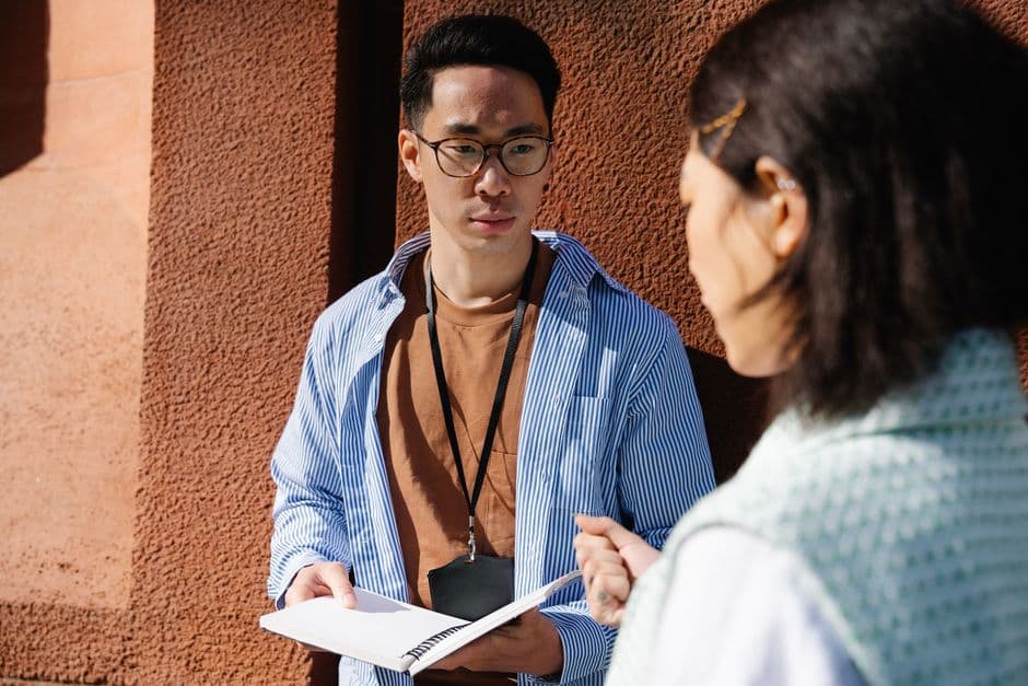 A student holding a notebook