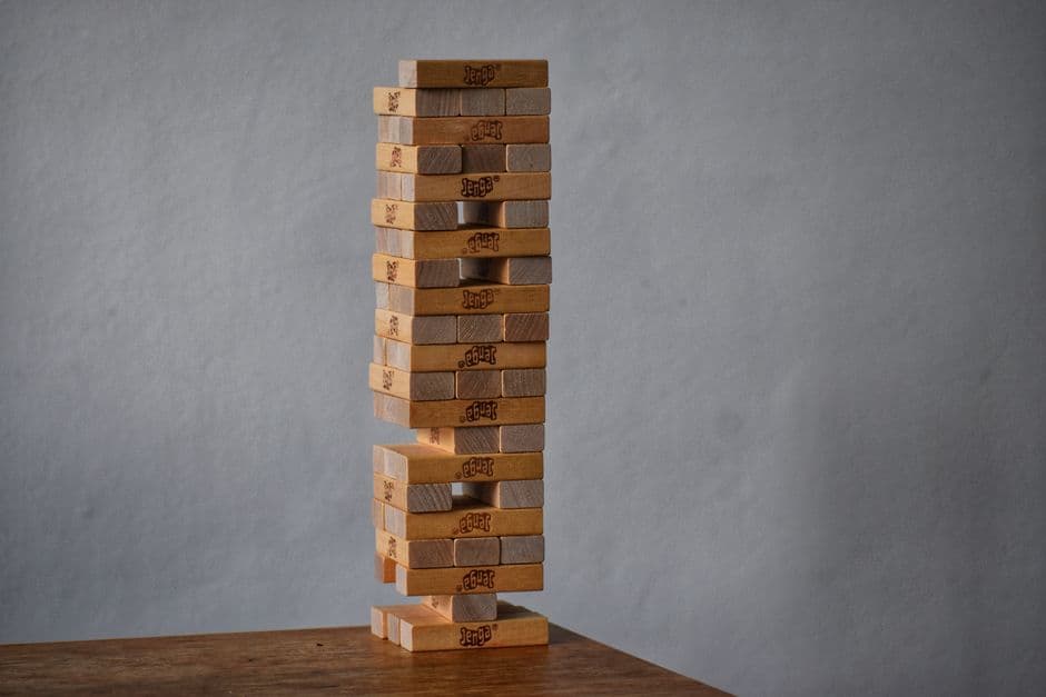 Wooden blocks stacked into a tower on a table