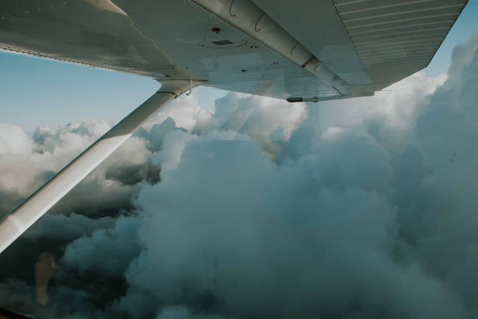 An airplane wing seen through a cabin window