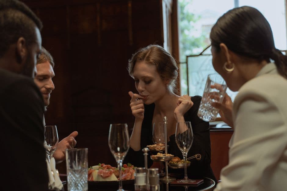 Friends sharing a meal at a restaurant table