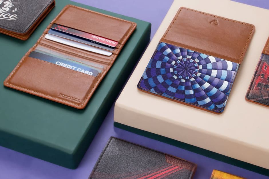Two leather wallets and cardholders side by side