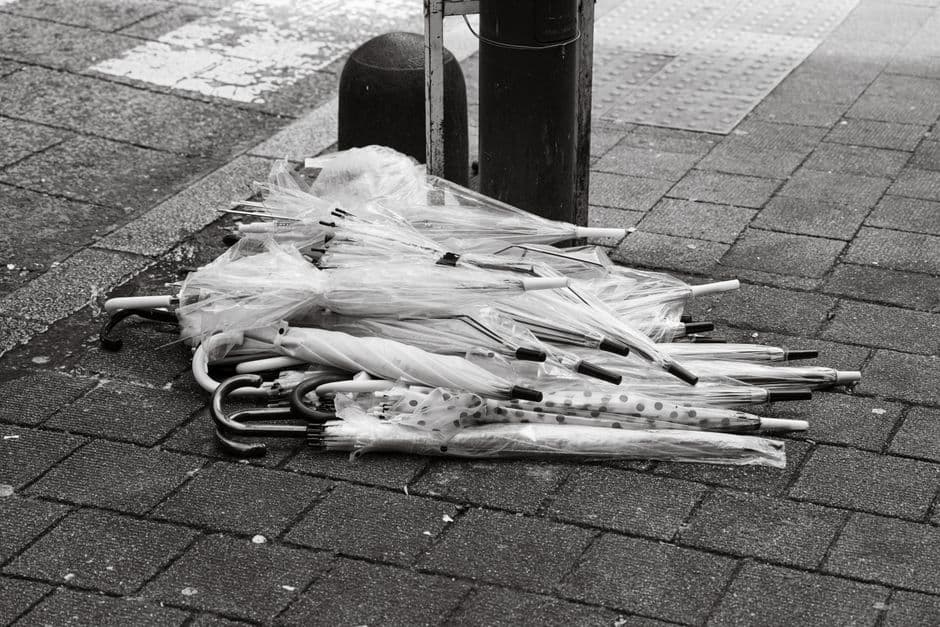 Clear umbrellas resting on a city street
