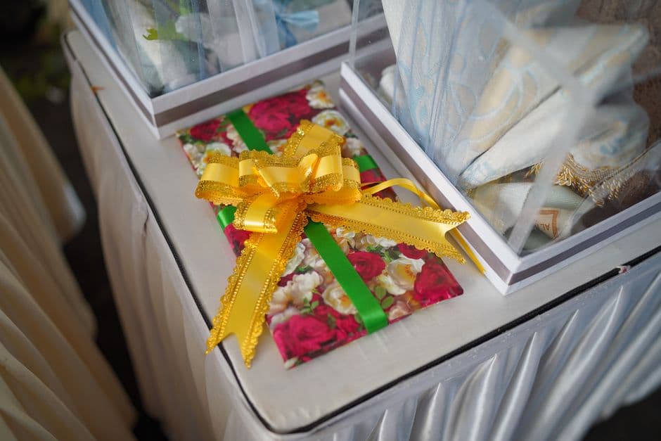A wrapped gift with a bow on a table