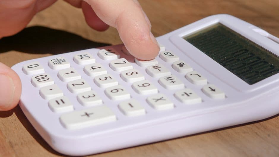 A person using a calculator
