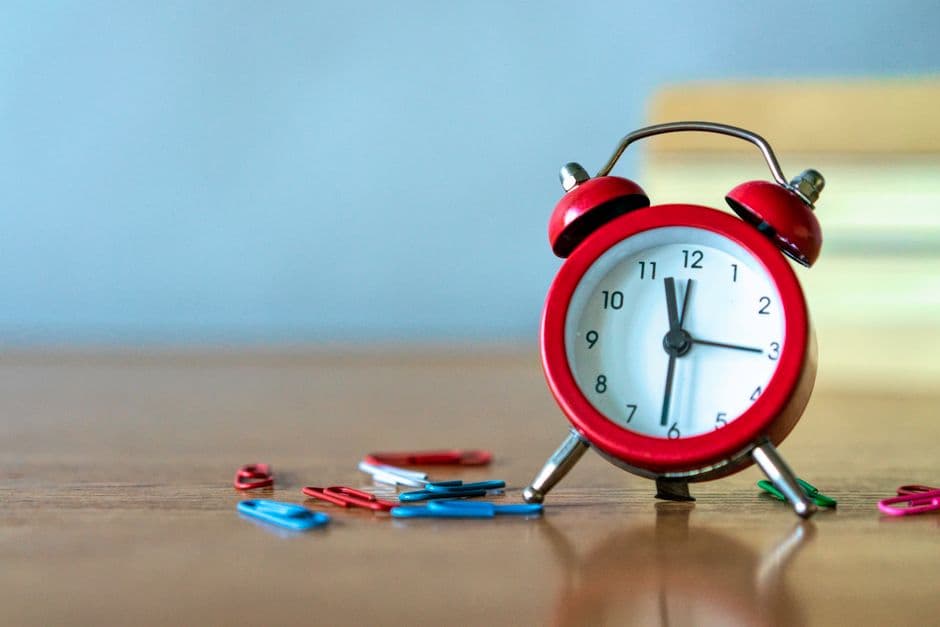 A close-up of an alarm clock face