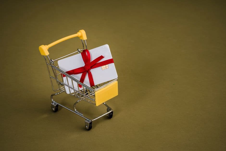 A gift card in a miniature shopping cart