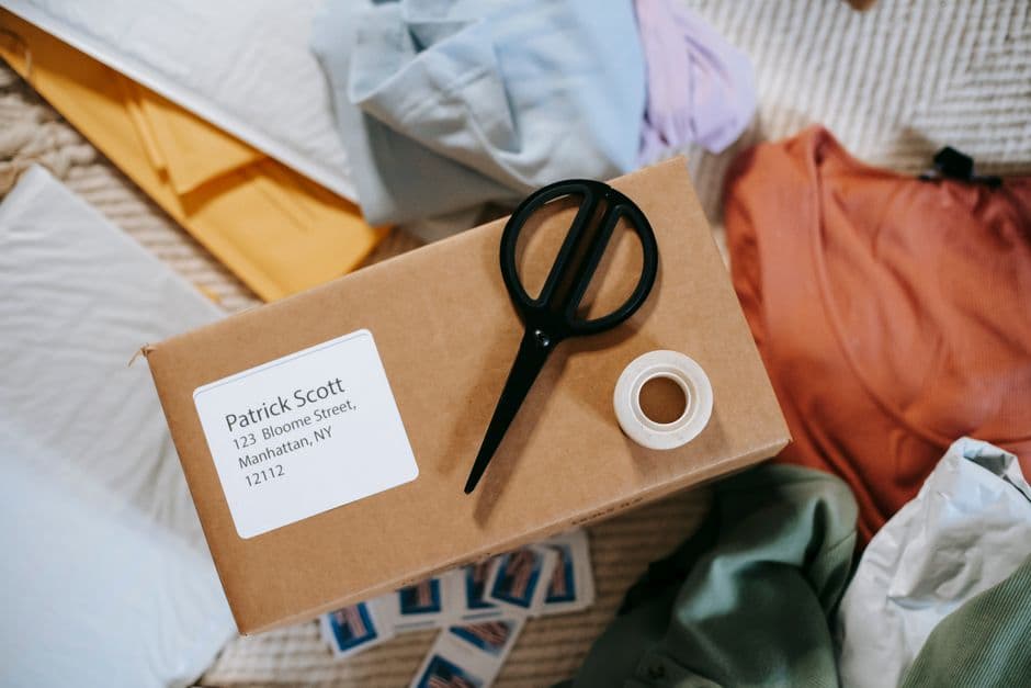 Scissors and tape on a parcel ready to return